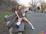 Hot young exotic chick flashes her pussy on a public park bench