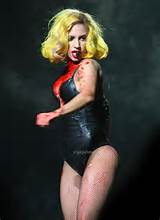 Lady Gaga as Vampirella in lingerie showing bloody cleavage on stage