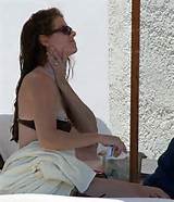 Debra Messing nipple slip on beach paparazzi pictures and posing nude