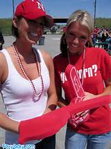 Two attractive babes getting wild at baseball game